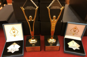 Photo displaying VXI's awards haul at the 2019 Stevie® Awards: Two Gold Stevies for Outsourcing Provider of the Year and Best Use of Technology in Customer Service, and two Silver Stevies for Outsourcing Provider of the Year and Contact Center or Customer Service Outsourcing Provider of the Year.