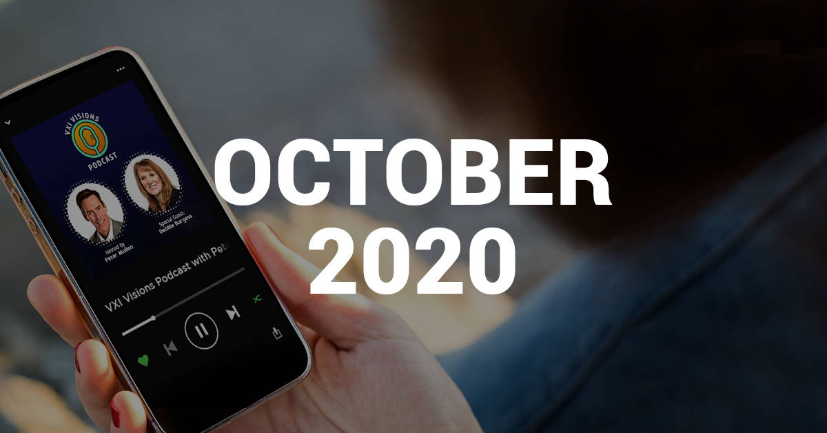 A person holding up a phone with the text october 2020.