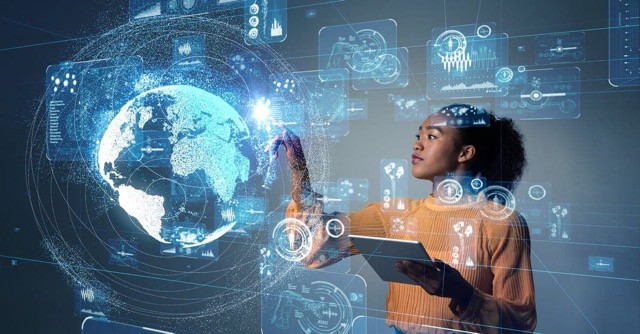 Photo of a woman holding a tablet and interacting with a digitally displayed futuristic world map in front of her.