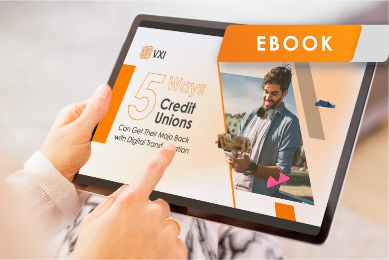 An electronic device displaying the cover of a VXI guide, '15 Ways Credit Unions Can Get Their Mojo Back with Digital Transformation'.